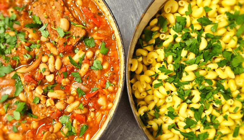 Cider balsamic braised tempeh with white beans in an arrabbiata sauce over cavatappi pasta. 1
